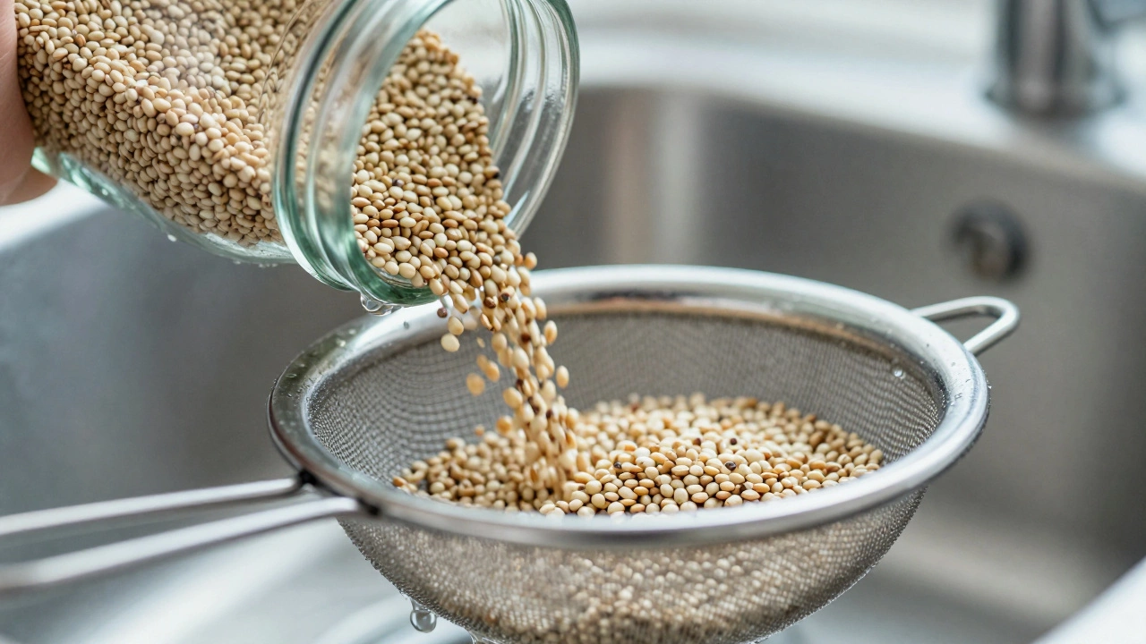 Quinoa seeds being rinsed in a sieve under running water to remove bitterness.